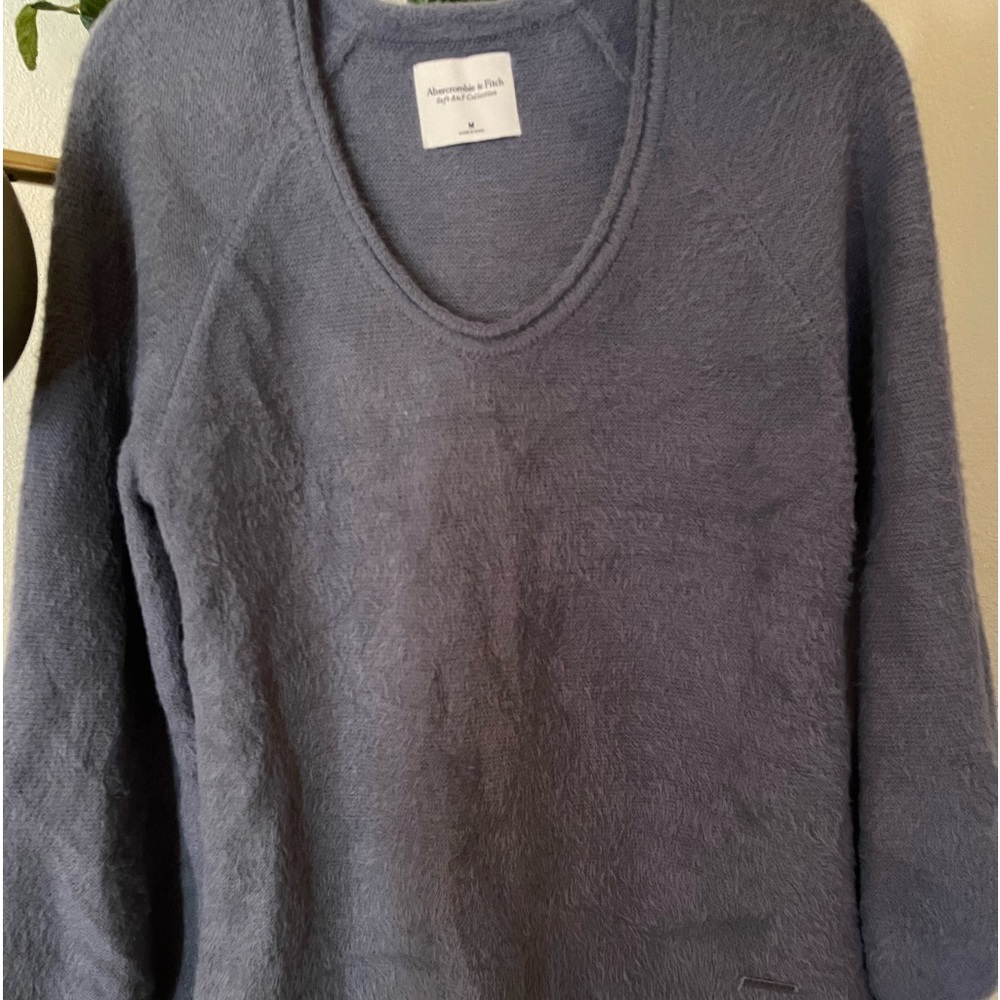 Sweater is very soft,  balloon sleeves.
